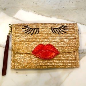 Straw clutch with lips and lashes